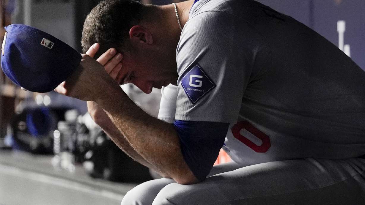 Los Angeles Dodgers pitcher Jack Flaherty sits in the dugout after being taken out of the game in the second inning against the New York Yankees in Game 5 of the baseball World Series, Wednesday, Oct. 30, 2024, in New York.