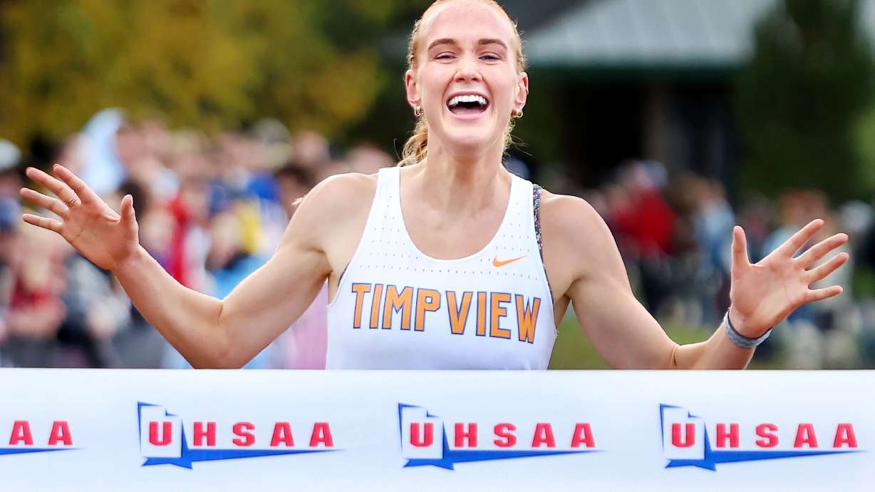 Timpview’s Jane Hedengren crosses the finish line during the 5A girls cross-country championships at Sugar House Park in Salt Lake City on Wednesday, Oct. 30, 2024.