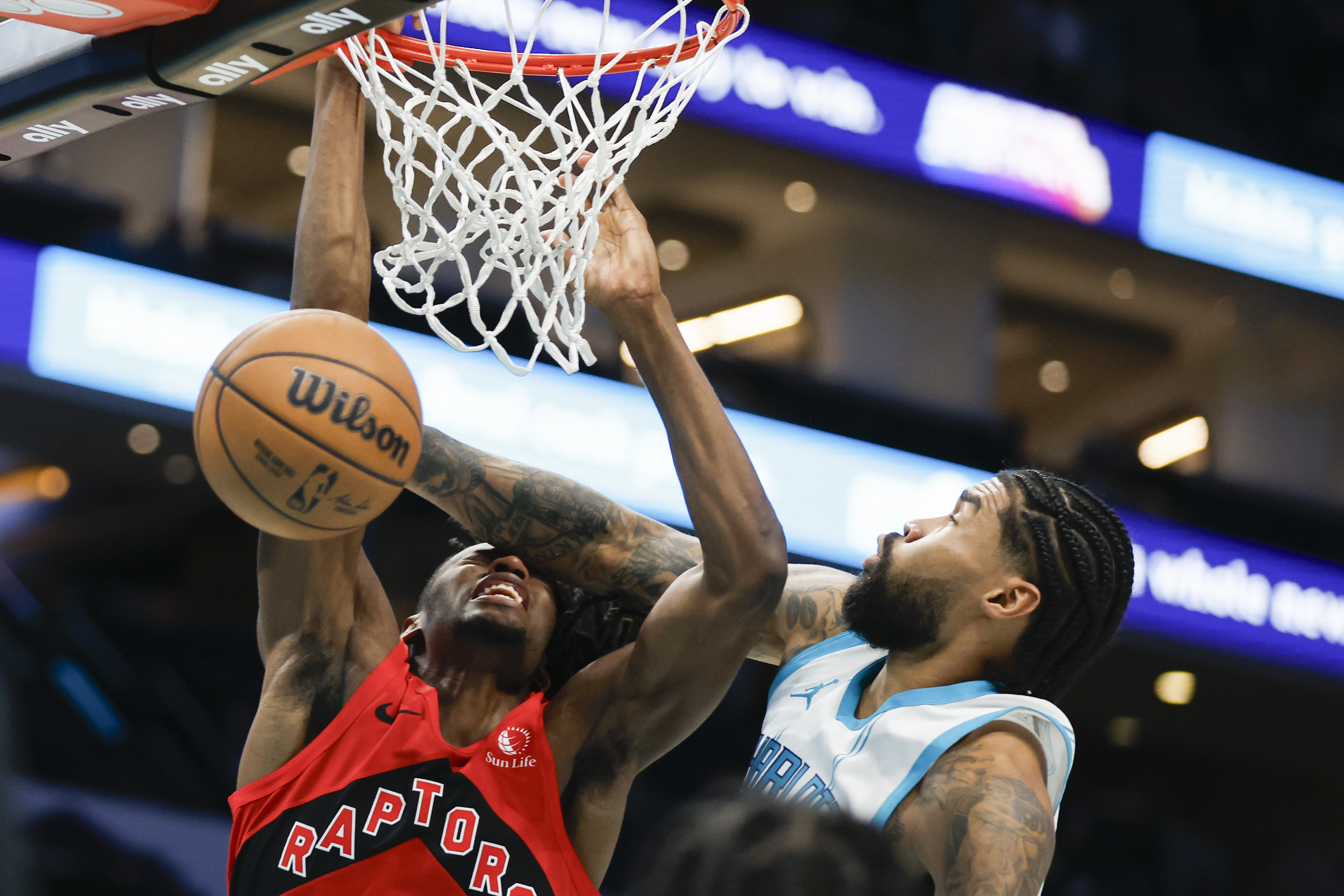 Tre Mann scores 27, Hornets get 72 points from their bench to beat Raptors 138-133 for 1st home win