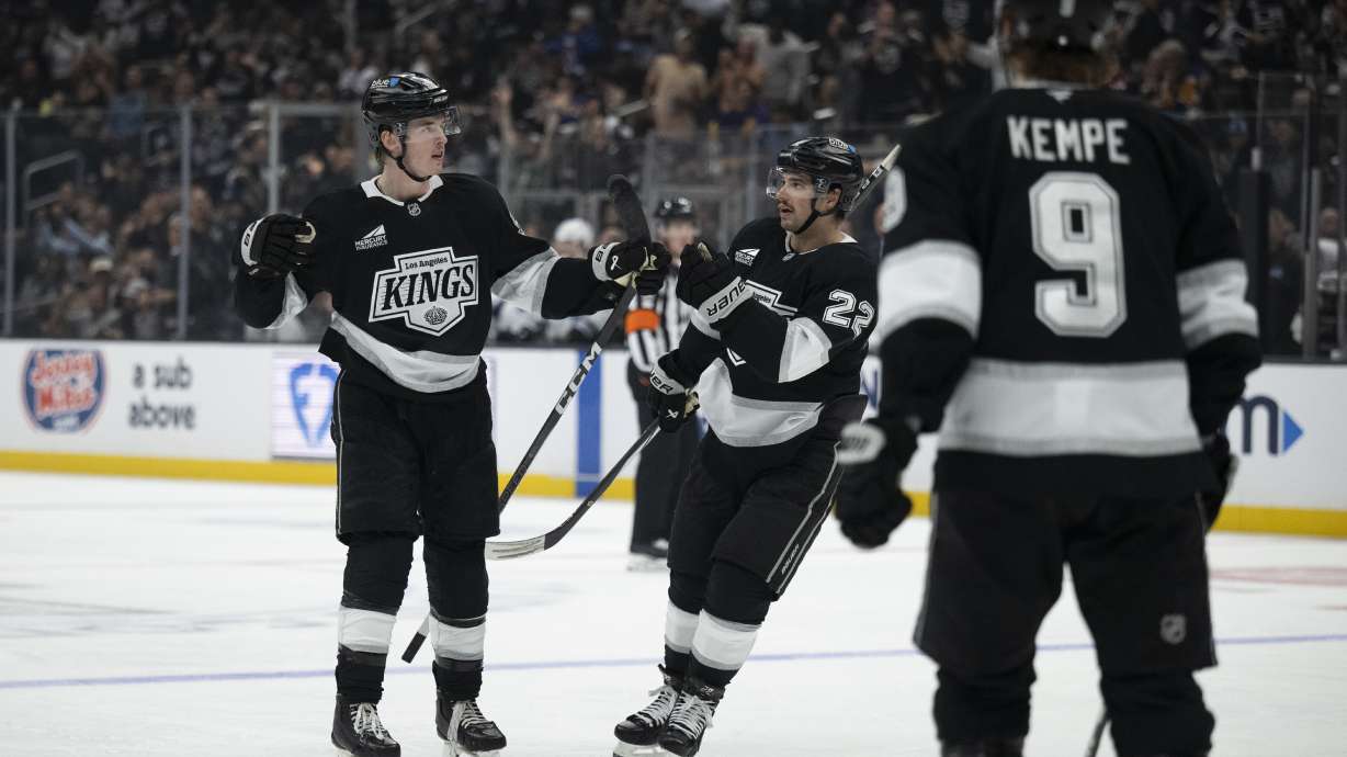 Los Angeles Kings defenseman Brandt Clarke (92) celebrates his goal with left wing Kevin Fiala (22) during the second period of an NHL hockey game against the Utah Hockey Club, Saturday, Oct. 26, 2024, in Los Angeles.