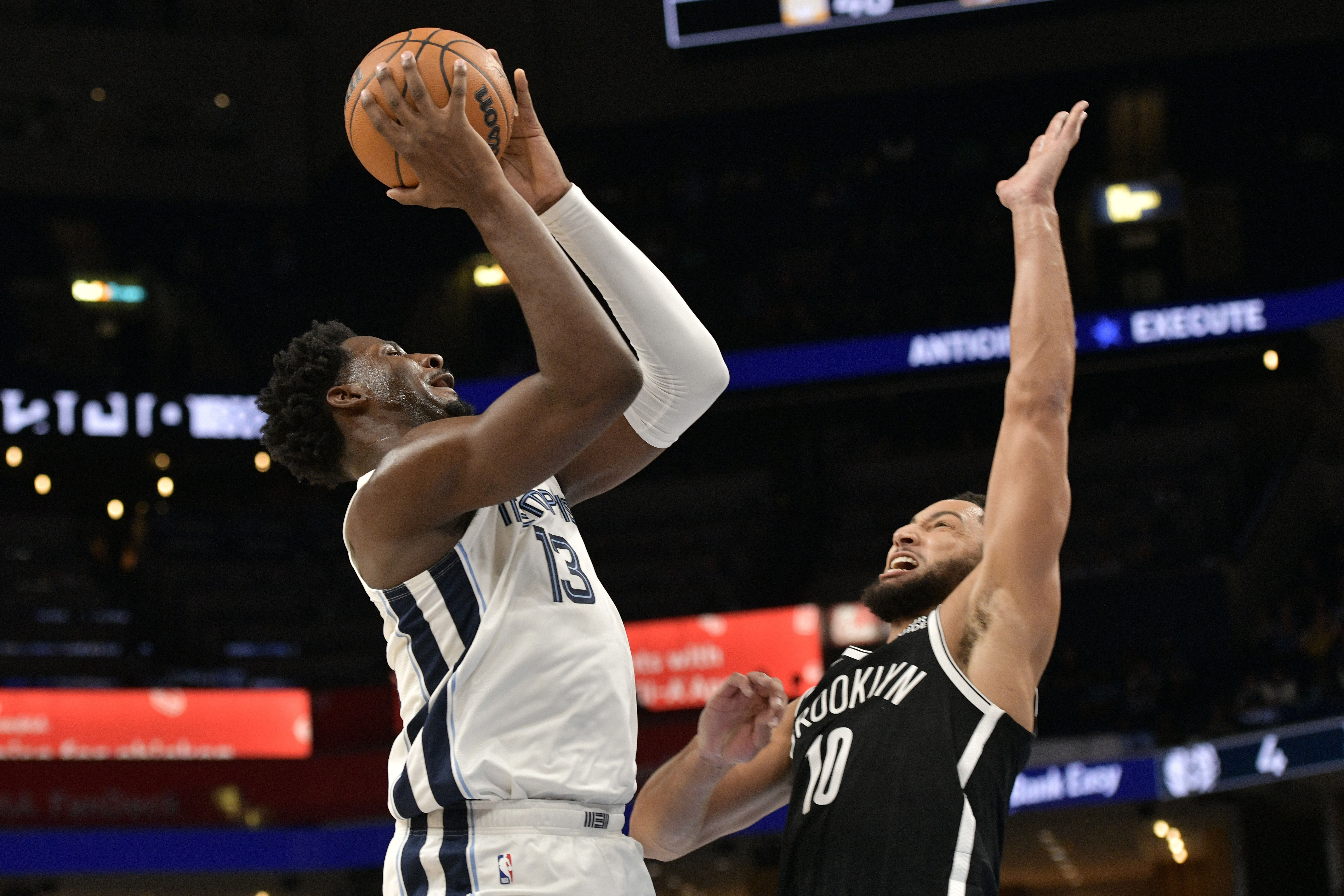 Memphis Grizzlies forward Jaren Jackson Jr. (13) shoots against Brooklyn Nets guard Ben Simmons (10) in the first half of an NBA basketball game Wednesday, Oct. 30, 2024, in Memphis, Tenn.