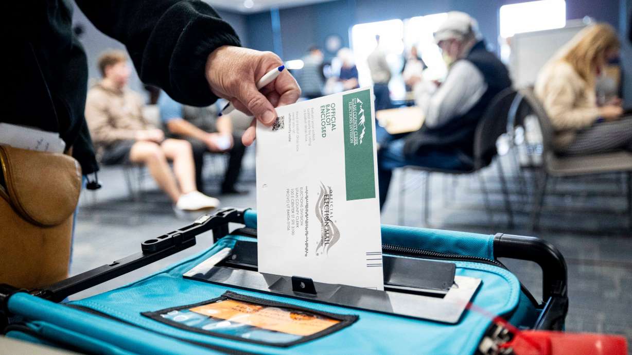A voter drops their ballot in a drop box at the Utah County Health and Justice Building in Provo on Wednesday. Utah County Attorney Jeff Gray confirmed Wednesday that his office is investigating Utah County Clerk Aaron Davidson's tracking of how elected officials cast their votes.