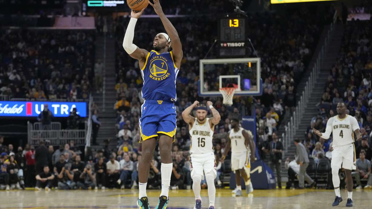 Golden State Warriors guard Buddy Hield (7) shoots a three-point basket at the first half buzzer during an NBA basketball game against the New Orleans Pelicans in San Francisco, Wednesday, Oct. 30, 2024.