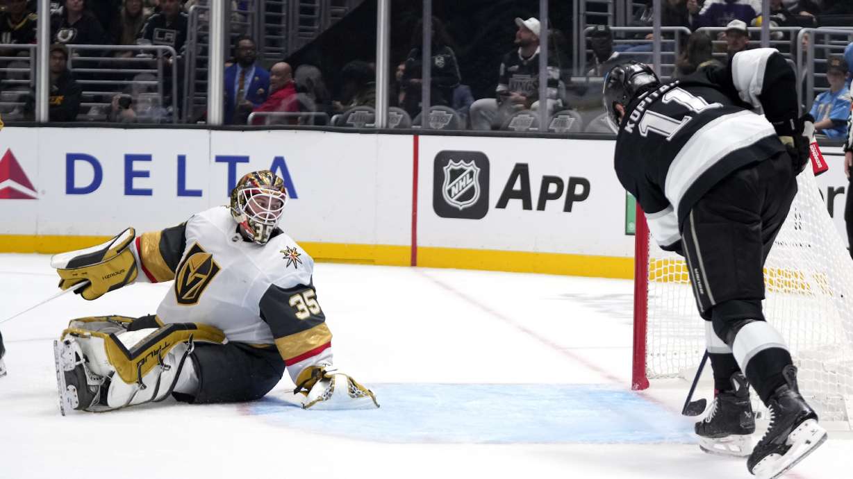 CORRECTS NAME AND TEAM OF GOALTENDER - Los Angeles Kings center Anze Kopitar, right, scores on Vegas Golden Knights goaltender Ilya Samsonov during the second period of an NHL hockey game, Wednesday, Oct. 30, 2024, in Los Angeles.