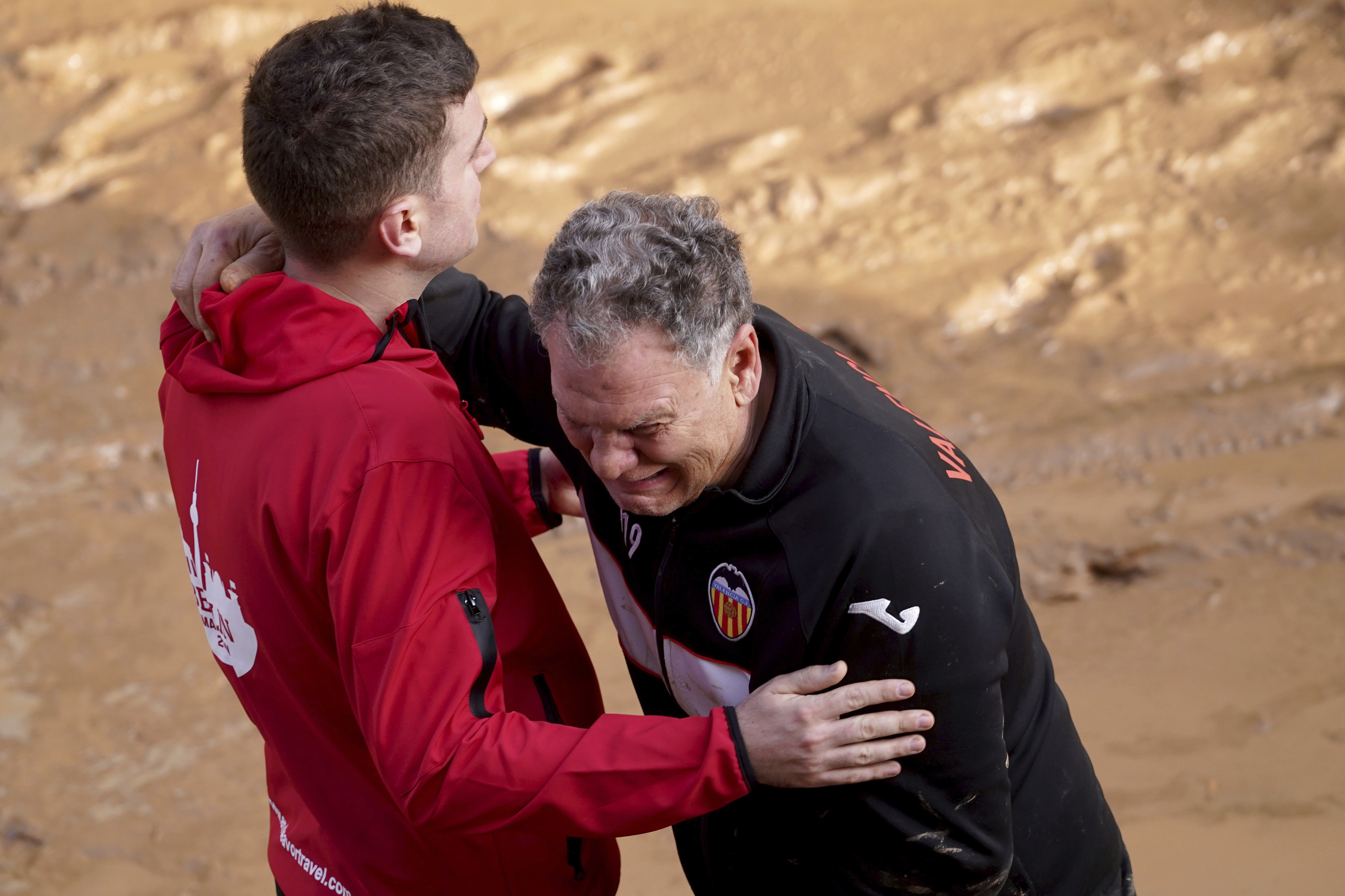 A man reacts as he waits for news of his relatives trapped during the floods in Valencia, Spain, Thursday.