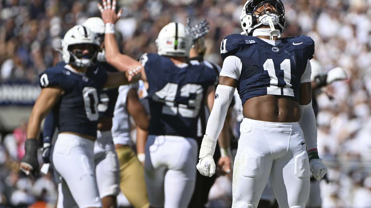 Penn State defensive end Abdul Carter (11) celebrates a tackle against UCLA during the third quarter of an NCAA college football game, Saturday, Oct. 5, 2024, in State College, Pa.