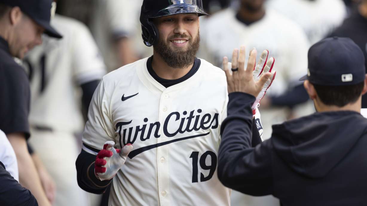 FILE - Minnesota Twins' Alex Kirilloff (19) is congratulated after his solo home run against the Texas Rangers during the fourth inning of a baseball game, May 24, 2024, in Minneapolis.