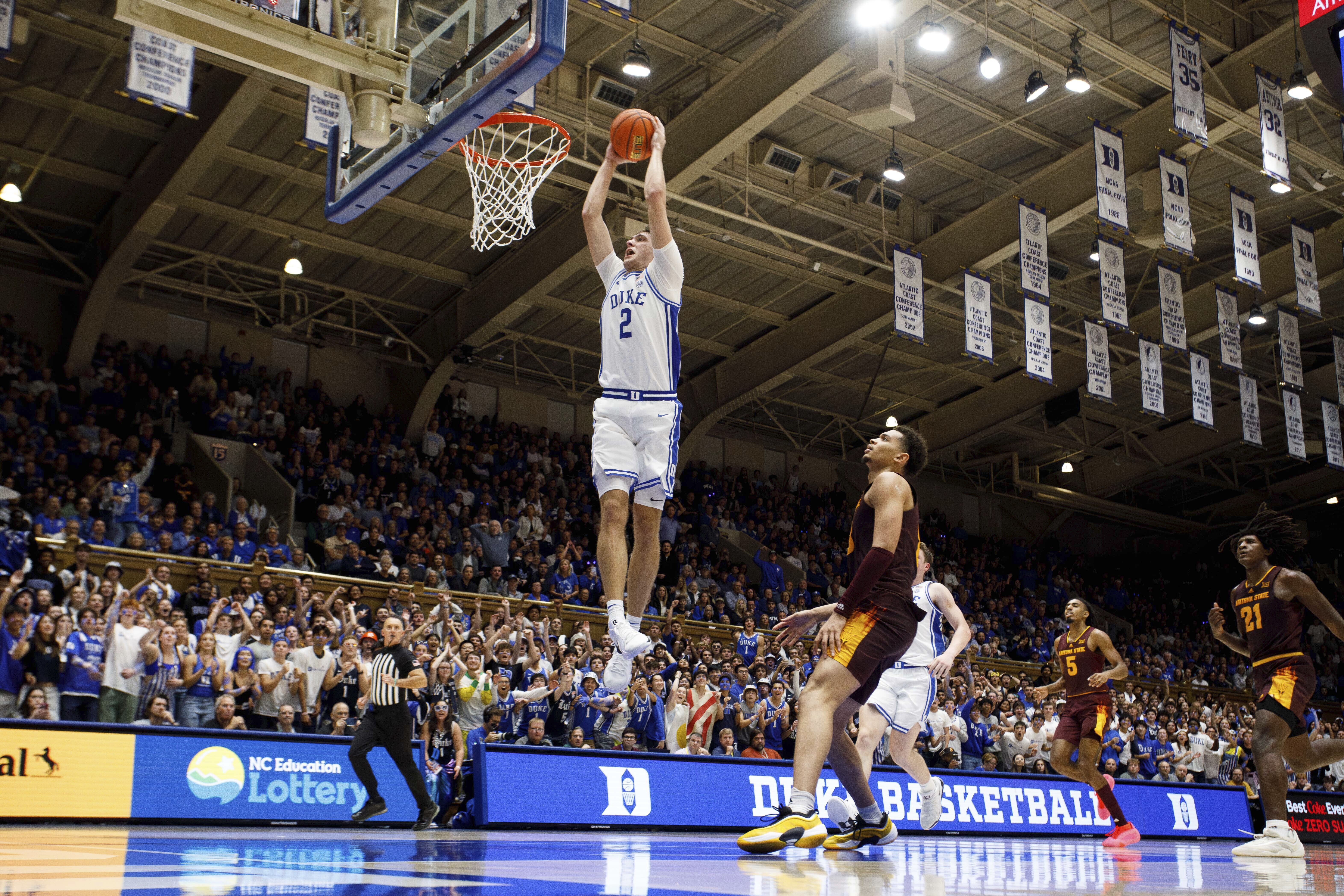 Duke's Cooper Flagg (2) dunks during the second half of an NCAA college basketball charity exhibition game against Arizona State in Durham, N.C., Sunday, Oct. 27, 2024.