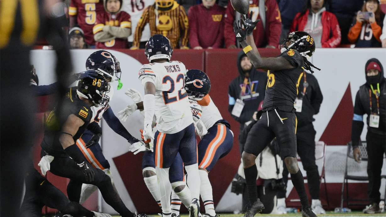 Washington Commanders wide receiver Noah Brown (85) catches a 52-yard touchdown pass in the end zone as time expires to give the Commanders an 18-15 win over the Chicago Bears in an NFL football game Sunday, Oct. 27, 2024, in Landover, Md.