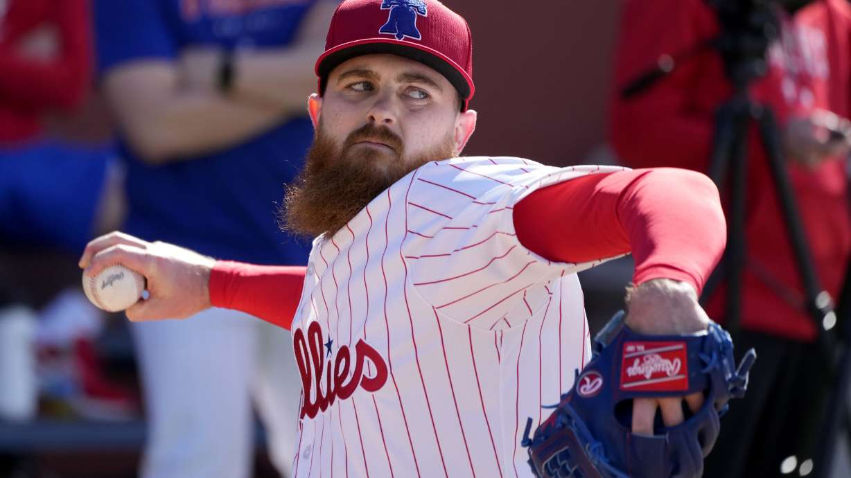 FILE - Philadelphia Phillies pitcher Dylan Covey throws during a baseball spring training workout Wednesday, Feb. 14, 2024, in Clearwater, Fla.