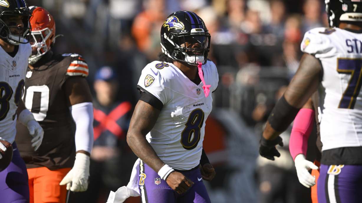 Baltimore Ravens quarterback Lamar Jackson (8) reacts after throwing a touchdown against the Cleveland Browns during the second half of an NFL football game in Cleveland, Sunday, Oct. 27, 2024.