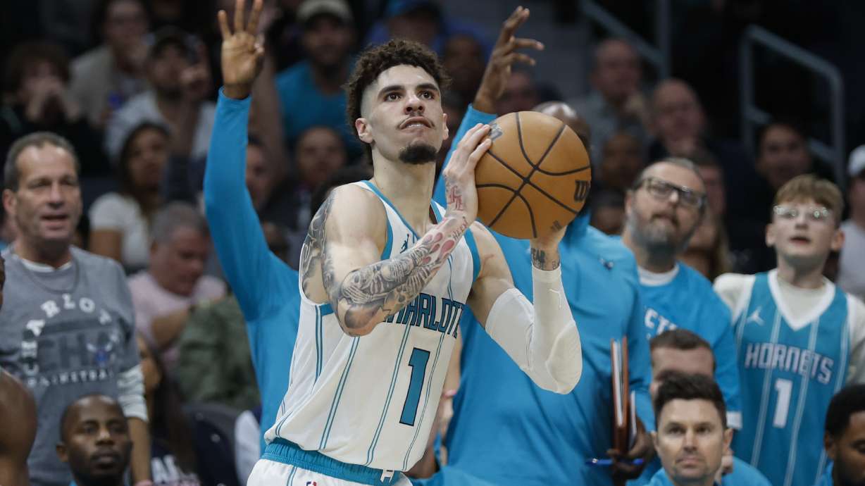 Charlotte Hornets guard LaMelo Ball looks to shoot a 3-pointer against the Toronto Raptors during the second half of an NBA basketball game in Charlotte, N.C., Wednesday, Oct. 30, 2024. Charlotte won 138-133.