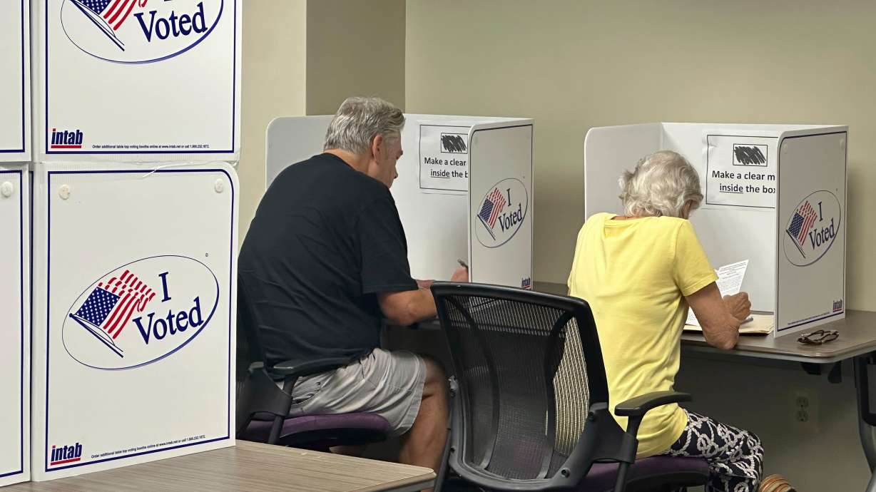 Voters cast their ballots on the first day of early voting, Sept. 20 in Alexandria, Va.