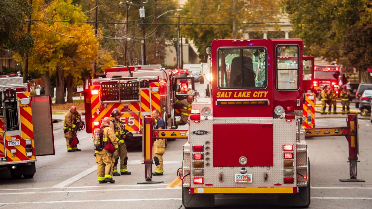 Firefighters respond to a fire at the abandoned Chateau Normandie in Salt Lake City on Thursday afternoon. One person was hospitalized. The fire flared up again Friday.