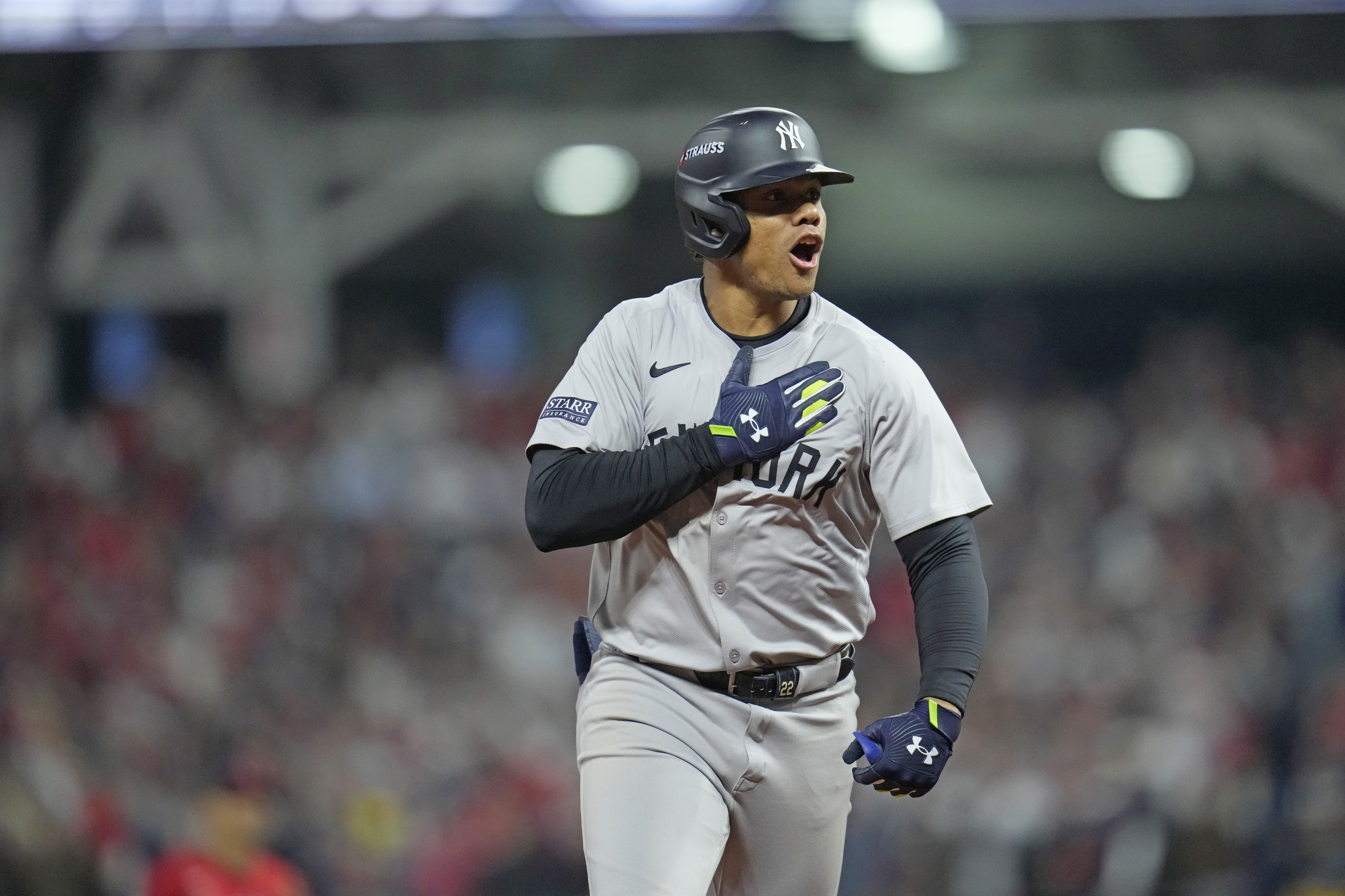 New York Yankees' Juan Soto celebrates after hitting a three-run home run against the Cleveland Guardians during the 10th inning in Game 5 of the baseball AL Championship Series Saturday, Oct. 19, 2024, in Cleveland. The Yankees won 5-2 to advance to the World Series.