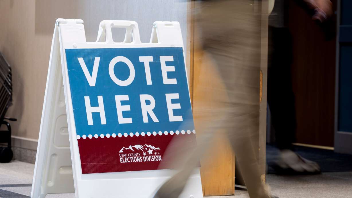 A voter makes their way to the polls during early voting for the upcoming general election held at the Utah County Health and Justice Building in Provo on Wednesday.