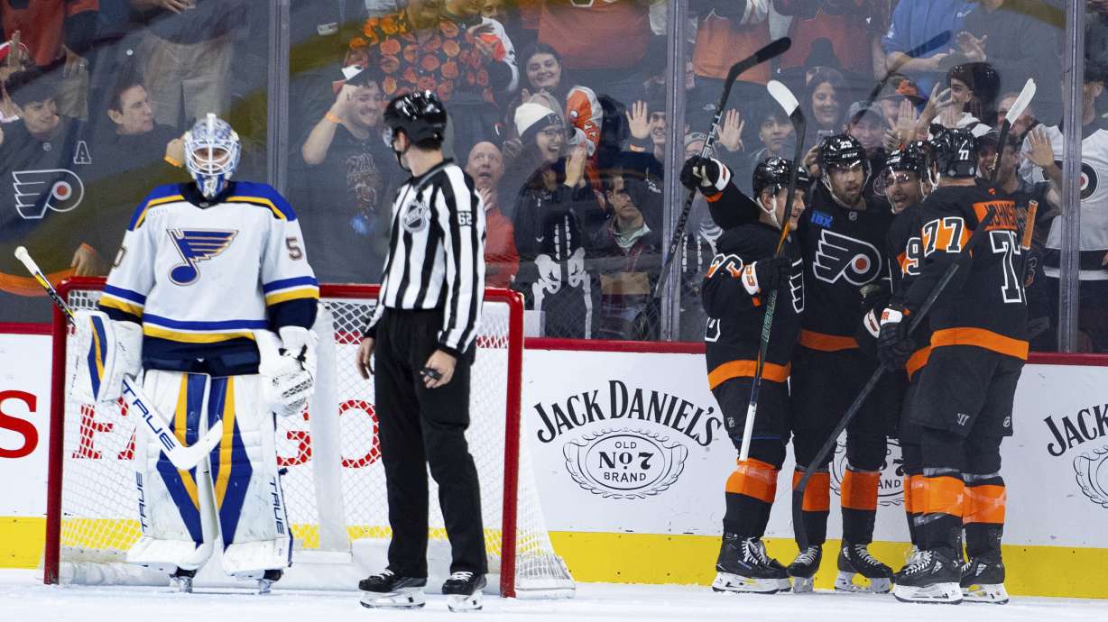 Philadelphia Flyers' Garnet Hathaway, second from right, celebrates his goal with teammates against St Louis Blues' Jordan Binnington, left, during the first period of an NHL hockey game, Thursday, Oct. 31, 2024, in Philadelphia.