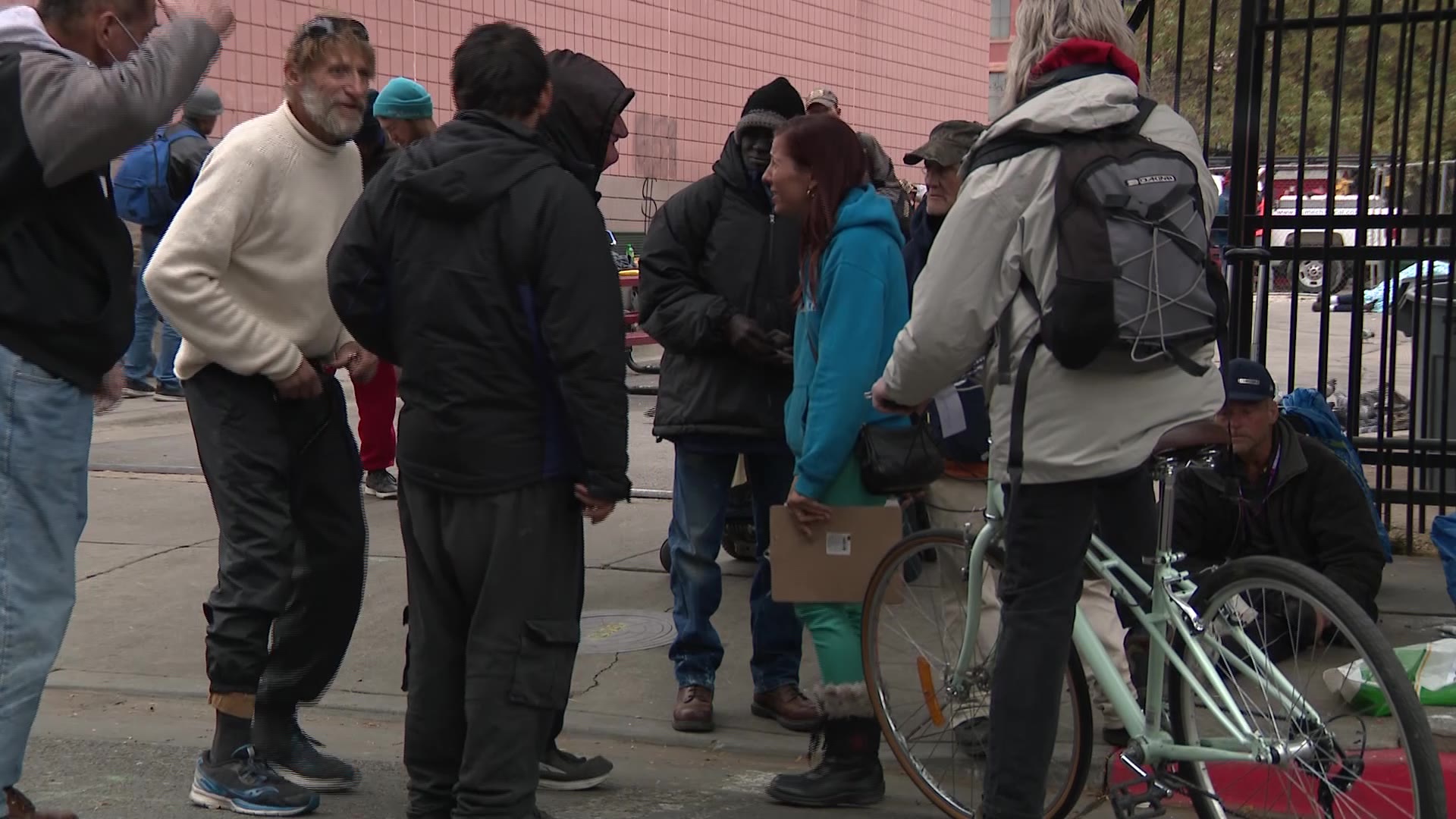 Kseniya Kniazeva talks to unsheltered people in Salt Lake City Thursday and gets them registered to vote.