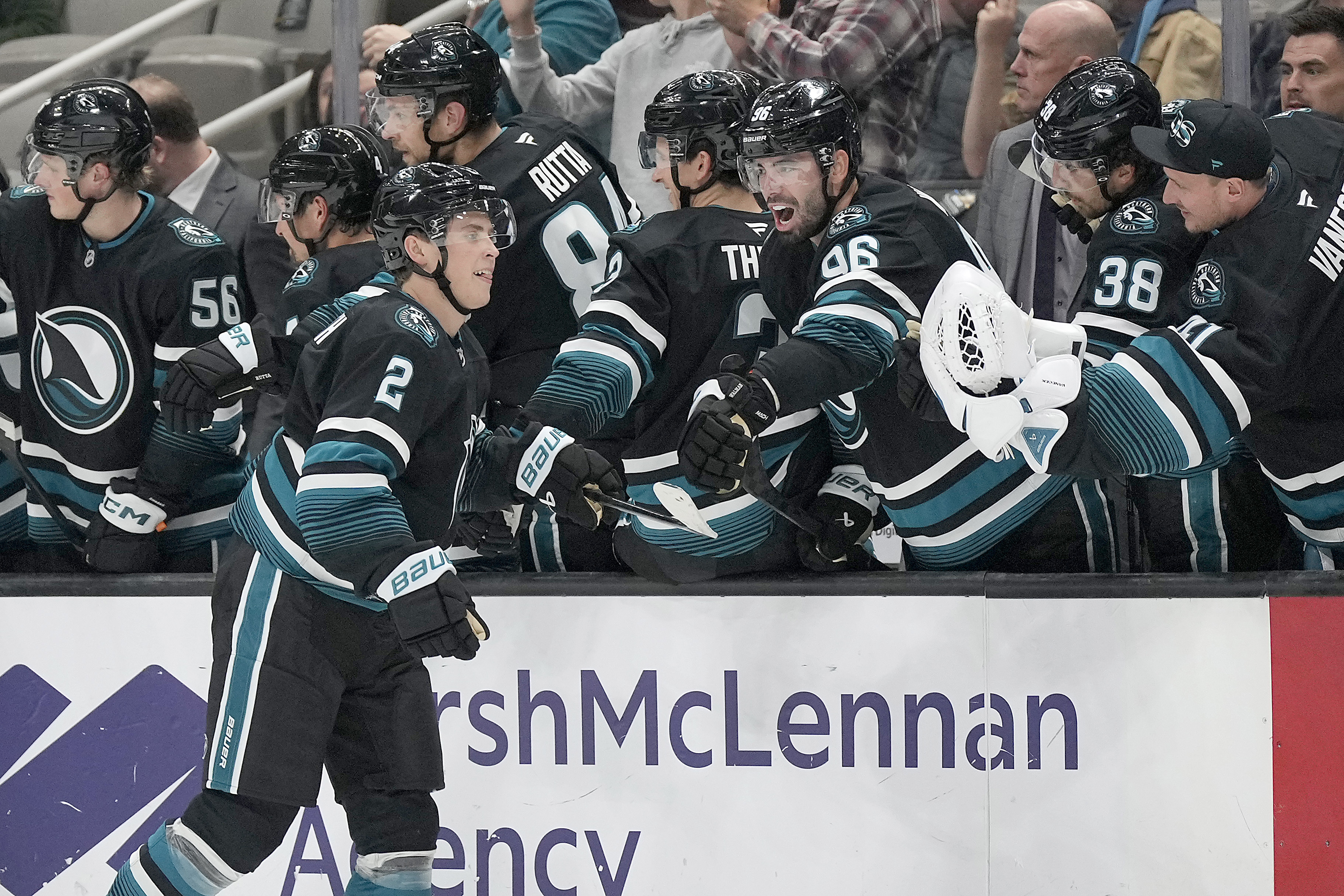 San Jose Sharks center Will Smith (2) celebrates with teammates after scoring a goal against the Chicago Blackhawks during the second period of an NHL hockey game in San Jose, Calif., Thursday, Oct. 31, 2024. 