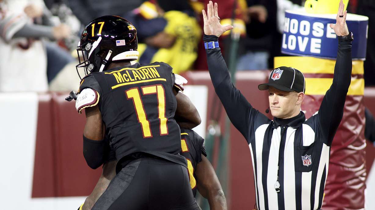 FILE - Washington Commanders wide receiver Terry McLaurin (17) celebrates with Washington Commanders wide receiver Noah Brown (85) after Brown scored the game-winning touchdown during an NFL football game against the Washington Commanders, Oct. 27, 2024 in Landover.