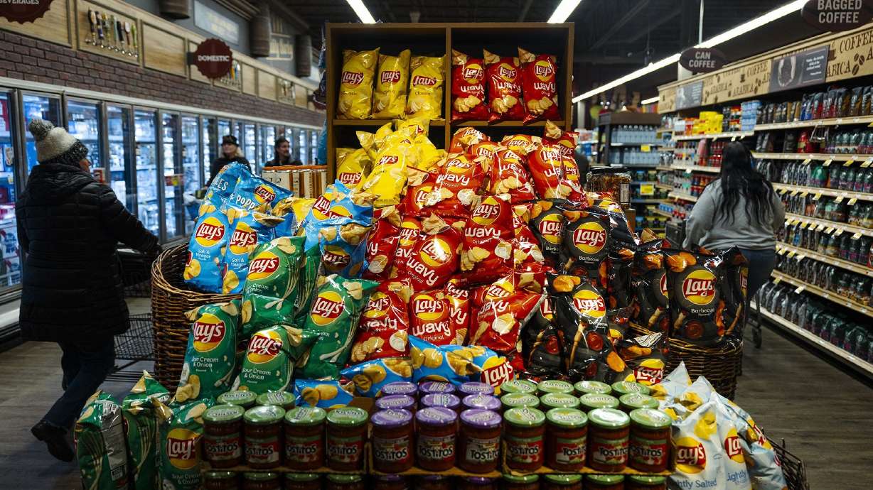 Consumers are turning away from pricier snacks and fast food. But they can't stop guzzling Coke and Dr Pepper.