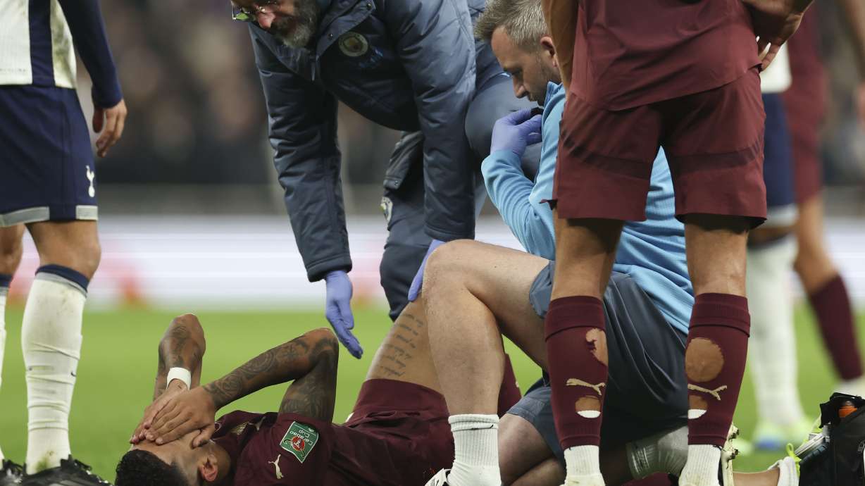 Manchester City's Savinho reacts after sustaining an injury during the English League Cup fourth round soccer match between Tottenham and Manchester City, at the Tottenham Hotspur Stadium in London, Wednesday, Oct 30, 2024.