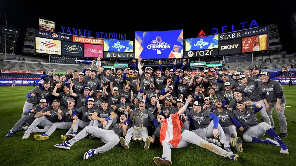 The Los Angeles Dodgers pose for a team picture after their win against the New York Yankees in Game 5 to win the baseball World Series, Thursday, Oct. 31, 2024, in New York.
