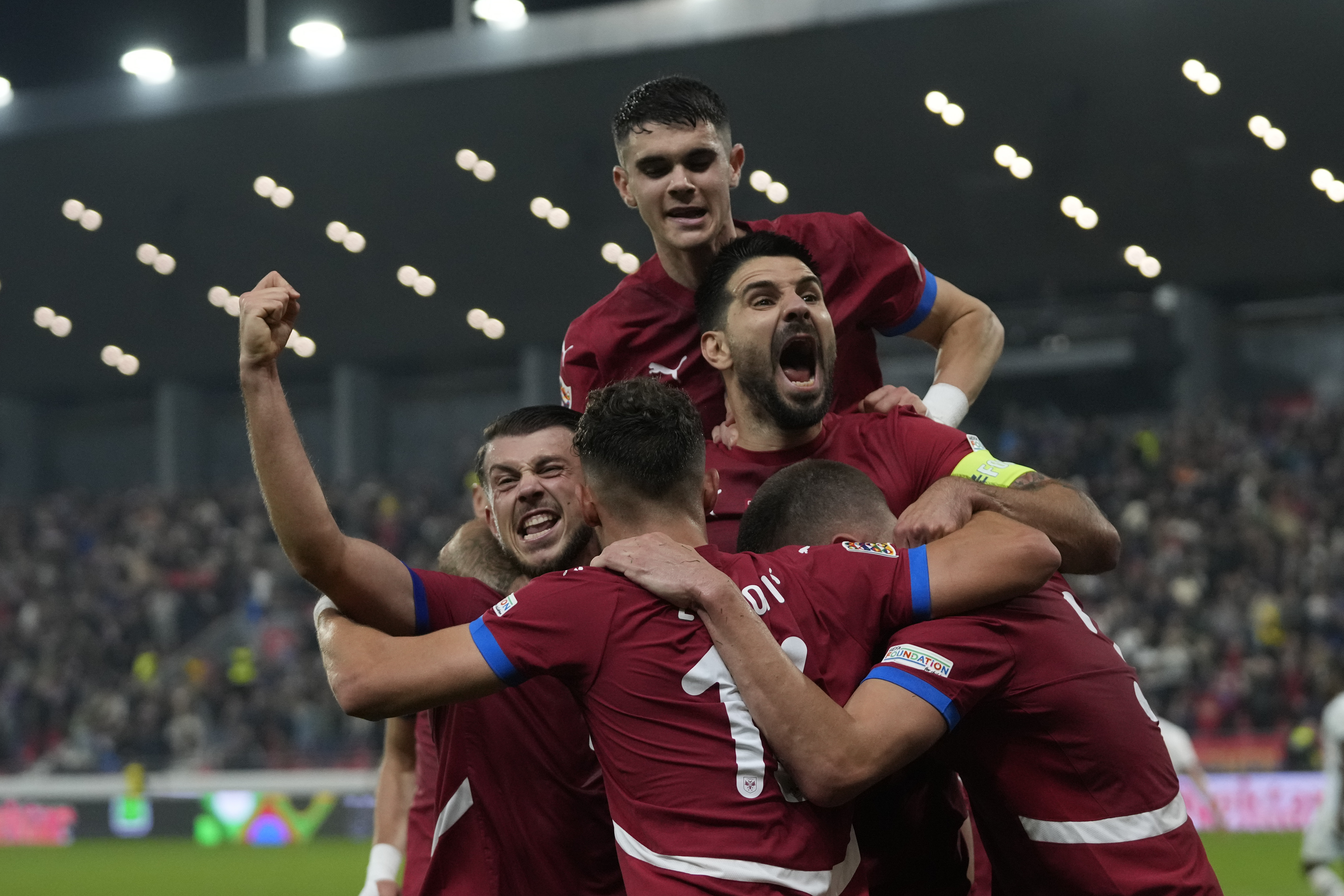 Serbia's players celebrate after a goal during the UEFA Nations League soccer match between Serbia and Switzerland at the Dubocica Stadium in Leskovac, Serbia, Saturday, Oct. 12, 2024.