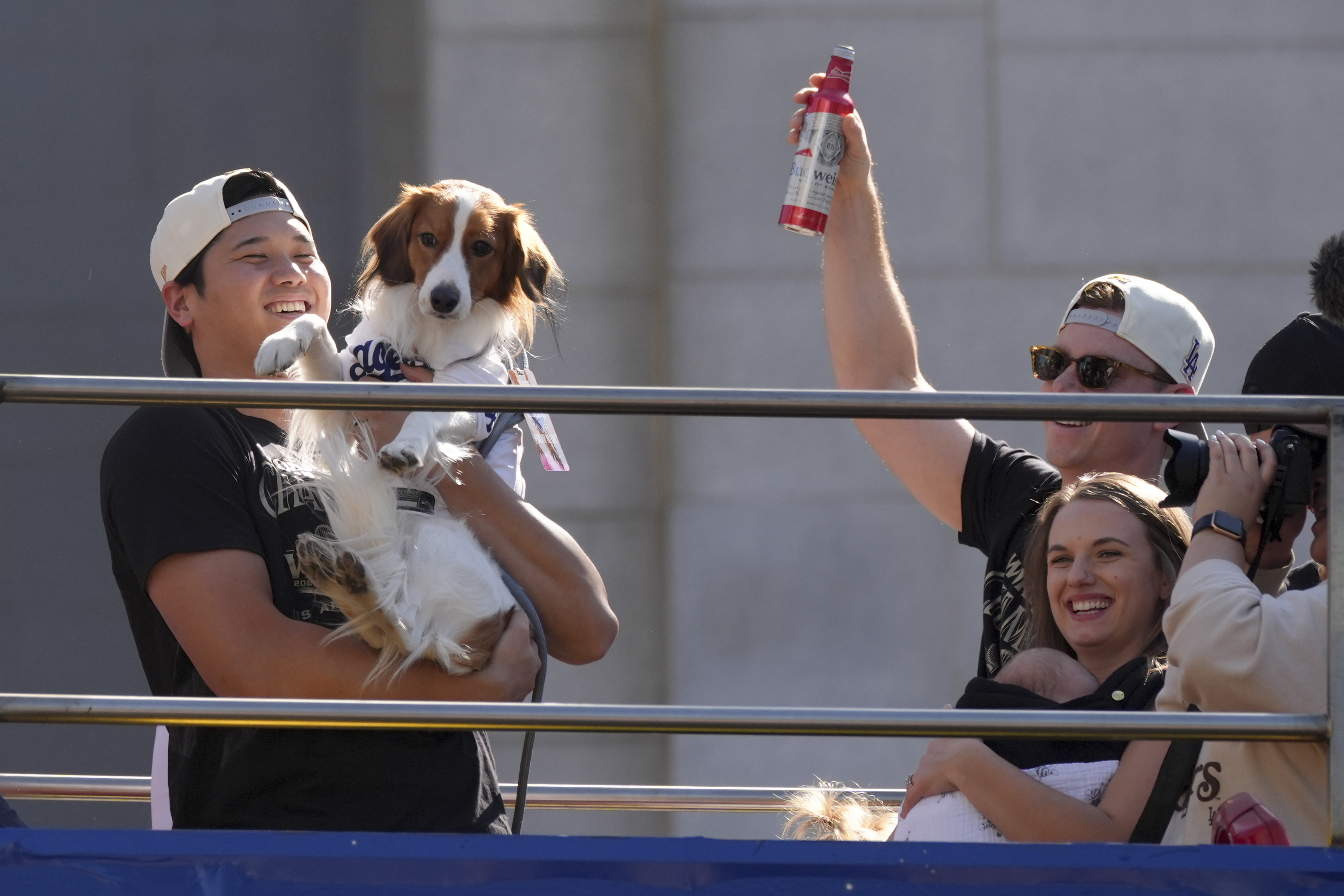 Los Angeles Dodgers' Shohei Ohtani holds his dog Decoy during the Los Angeles Dodgers baseball World Series championship parade Friday, Nov. 1, 2024, in Los Angeles.