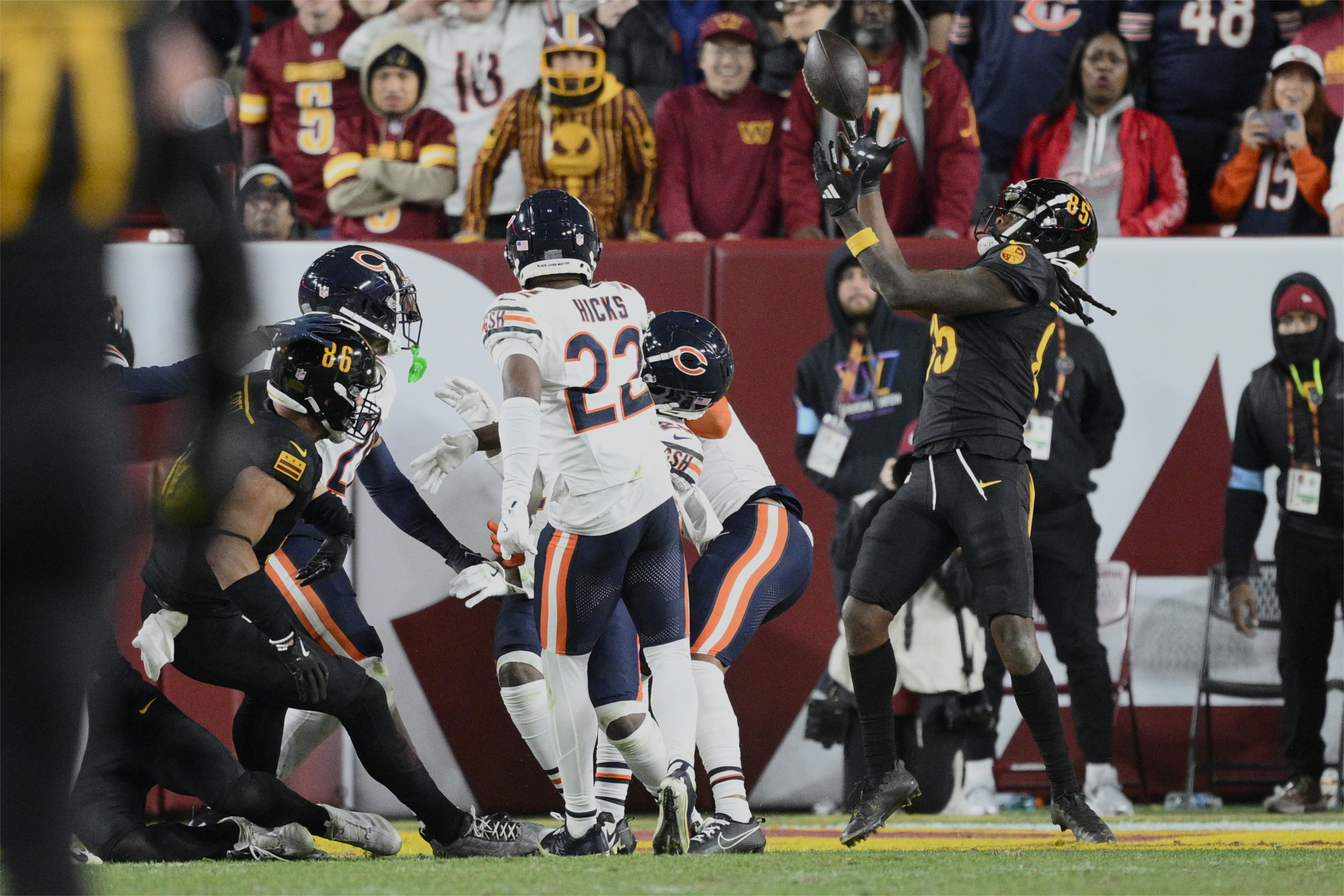 Washington Commanders wide receiver Noah Brown (85) catches a 52-yard touchdown pass in the end zone as time expires to give the Commanders an 18-15 win over the Chicago Bears in an NFL football game Sunday, Oct. 27, 2024, in Landover, Md.