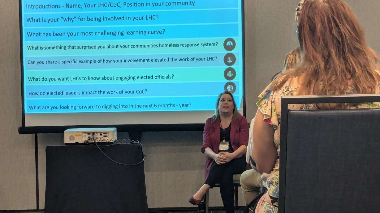 Heather Hogue, center, from Mountainland Continuum of Care, speaks to a group during a breakout session at the 20th Annual Utah Homelessness conference.