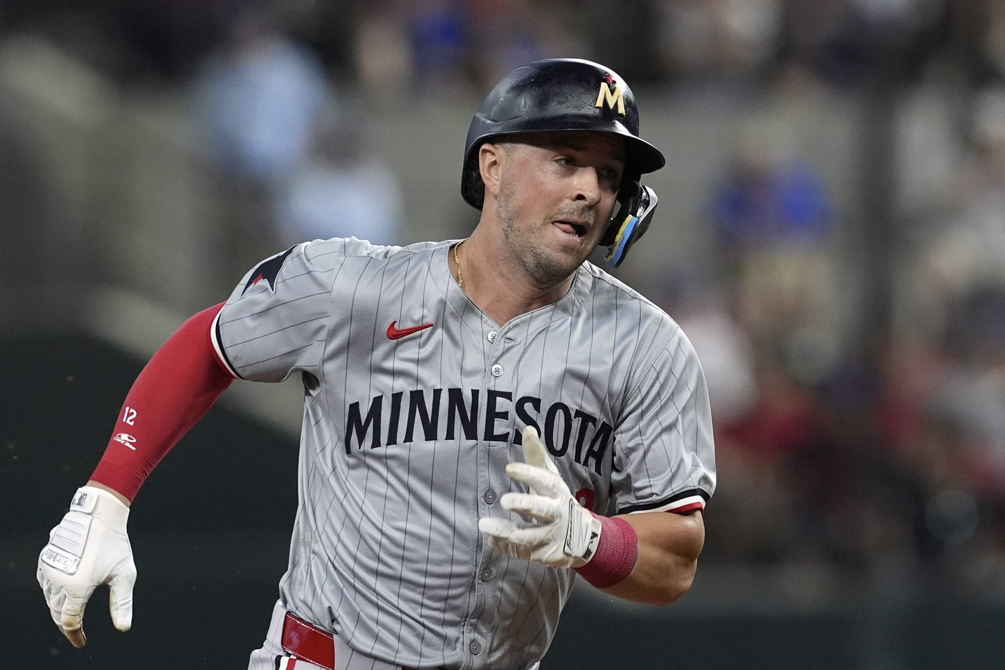 FILE - Minnesota Twins' Kyle Farmer sprints to third during a baseball game against the Texas Rangers, Thursday, Aug. 15, 2024, in Arlington, Texas.