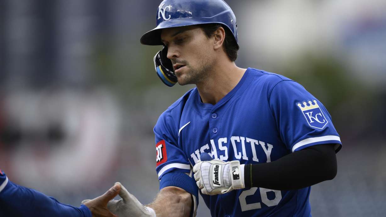 FILE - Kansas City Royals' Adam Frazier reacts at first base after his single drove in two runs during the ninth inning of a baseball game against the Washington Nationals, Thursday, Sept. 26, 2024, in Washington.