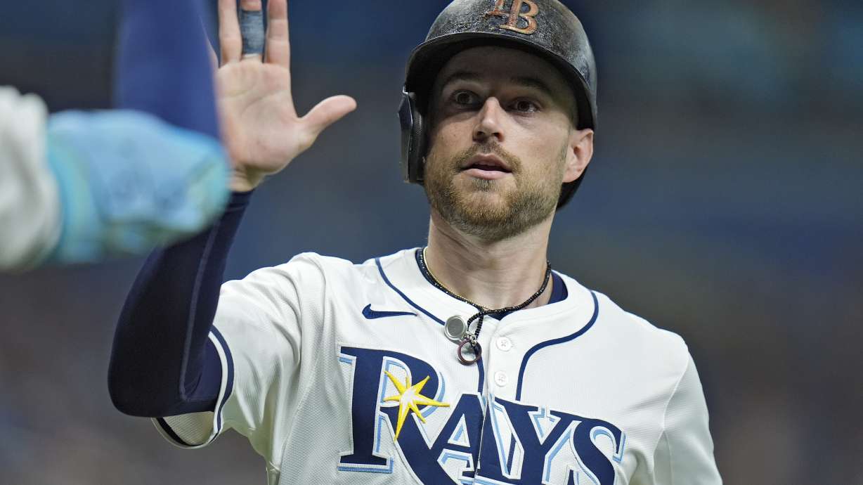 FILE - Tampa Bay Rays' Brandon Lowe celebrates after scoring on an RBI double by Junior Caminero off Minnesota Twins starting pitcher Simeon Woods Richardson during the third inning of a baseball game, Sept. 2, 2024, in St. Petersburg, Fla.