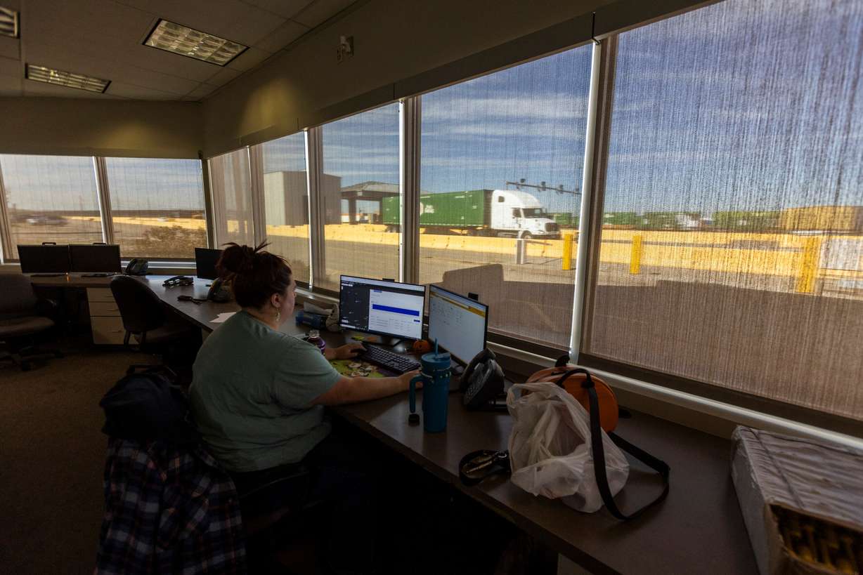 Yard checker Staci Stratton works on an inventory of the yard while semitrailers drive through the Salt Lake City Intermodal Terminal in Salt Lake City on Friday. Utah has been selected by the U.S. Environmental Protection Agency to receive a historic grant of $112 million through the Clean Ports Program.