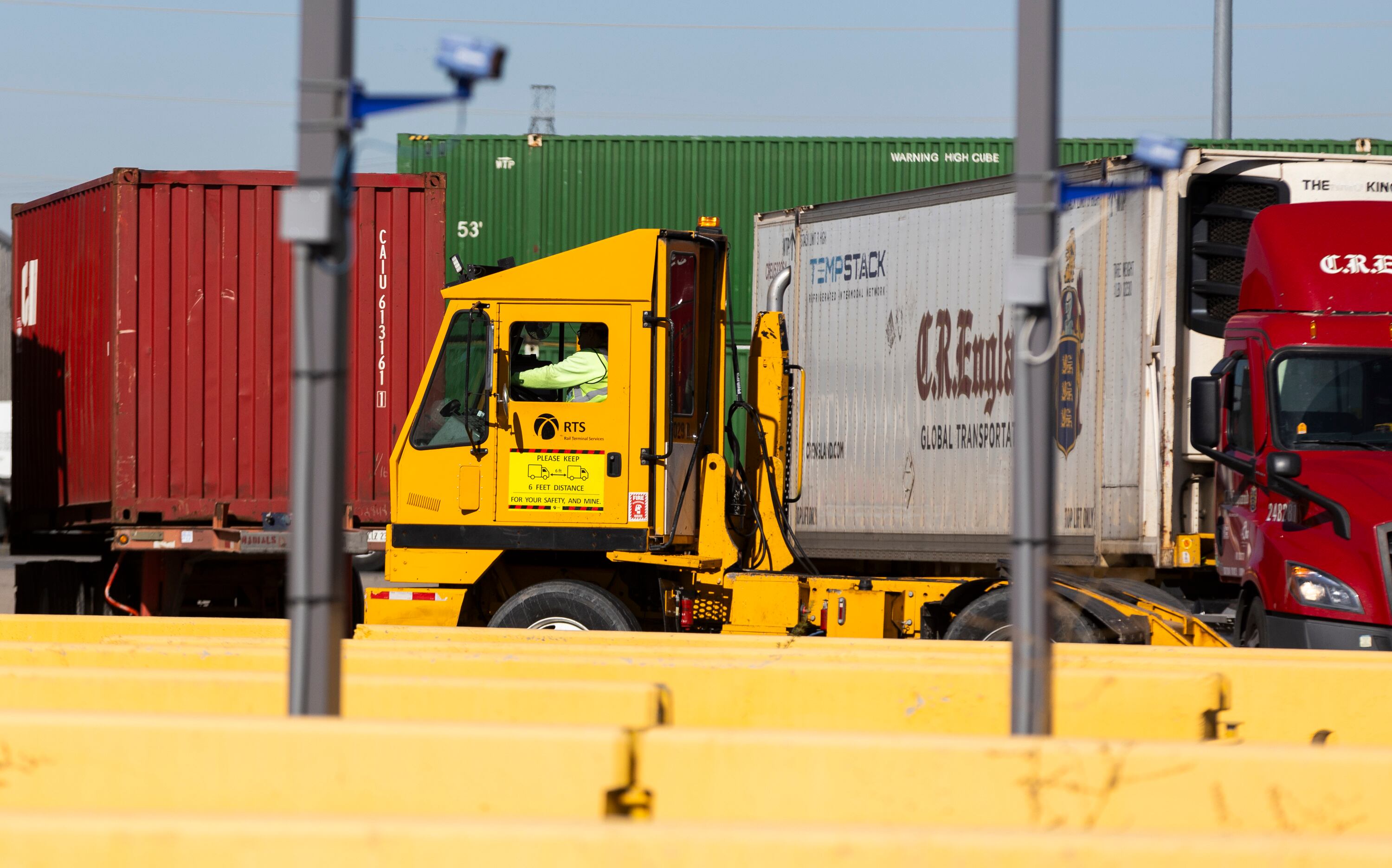 A terminal tractor, also known as a hostler, drives through the Salt Lake City Intermodal Terminal in Salt Lake City on Friday. Terminal tractors are used to move semitrailers around in the yard after they are delivered.