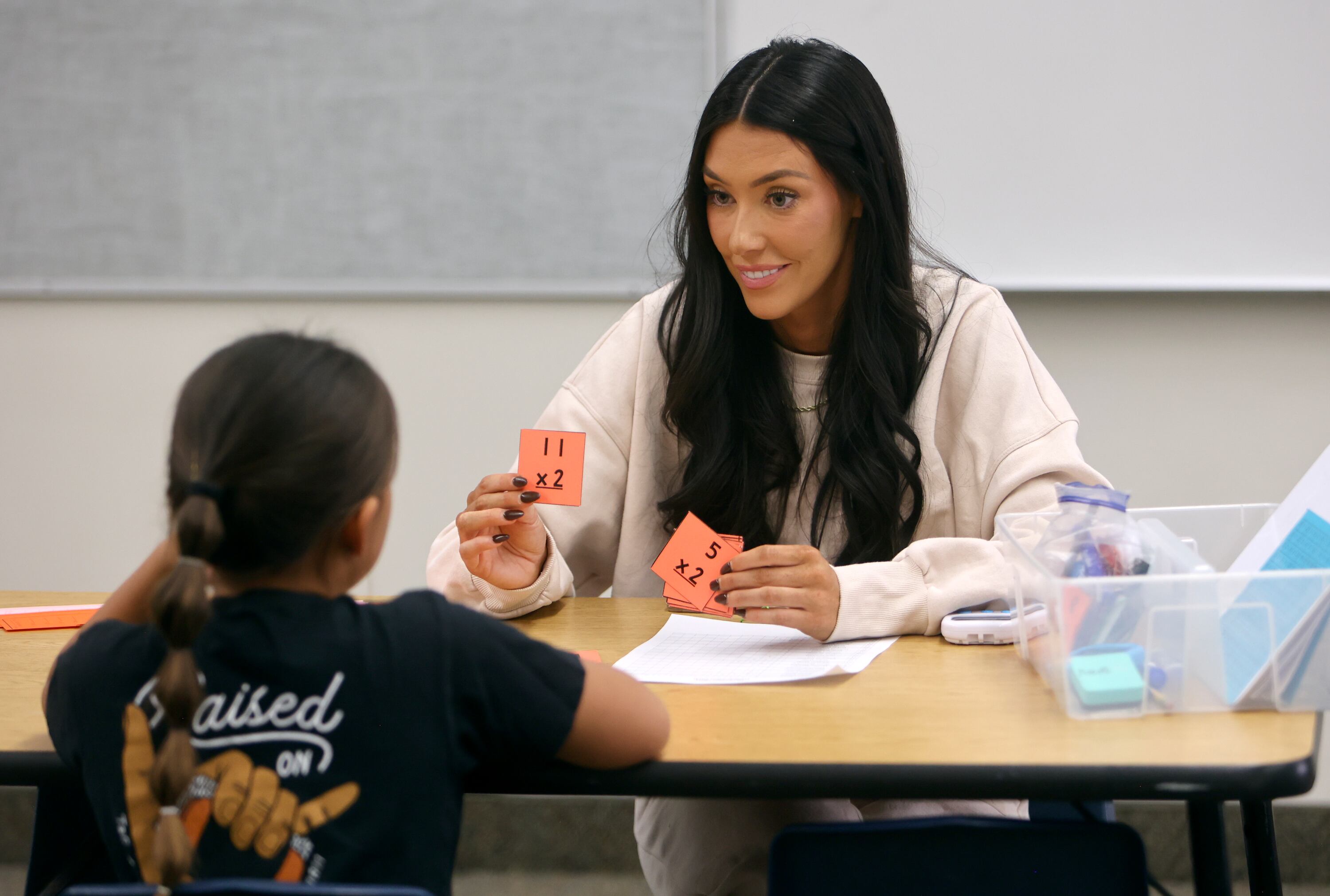 Brittany Maddux, a parent volunteer, helps third grader Babby Akina with math at Westfield Elementary School in Alpine on Oct. 16.