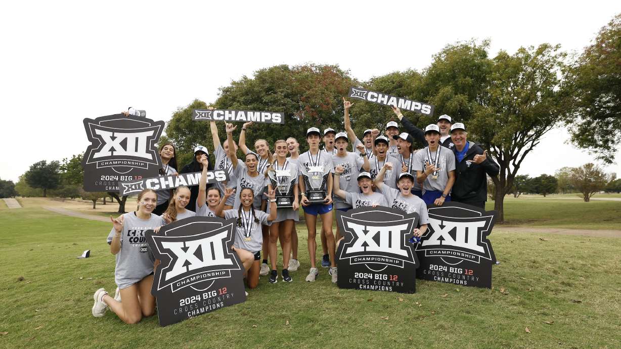 BYU men's and women's cross country team pose for a photo after sweeping the Big 12 conference championship, Friday, Nov. 1, 2024, in Waco, Texas.