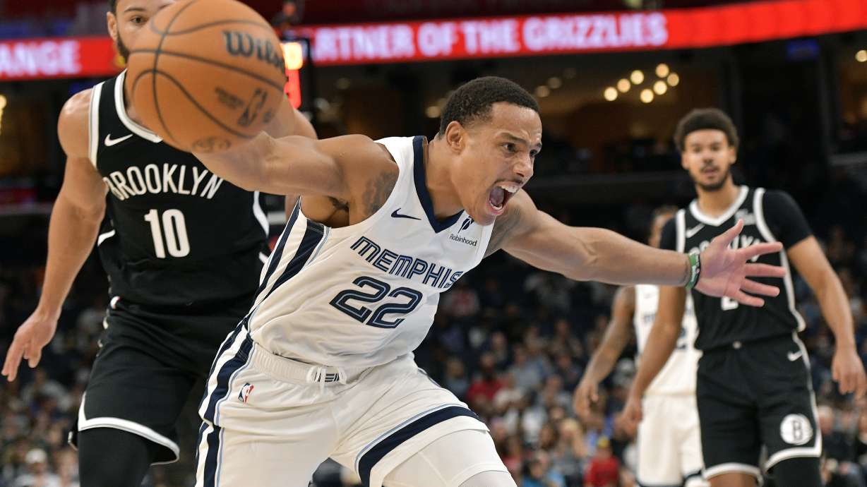 Memphis Grizzlies guard Desmond Bane (22) loses control of the ball as Brooklyn Nets guard Ben Simmons (10) looks on in the first half of an NBA basketball game Wednesday, Oct. 30, 2024, in Memphis, Tenn.