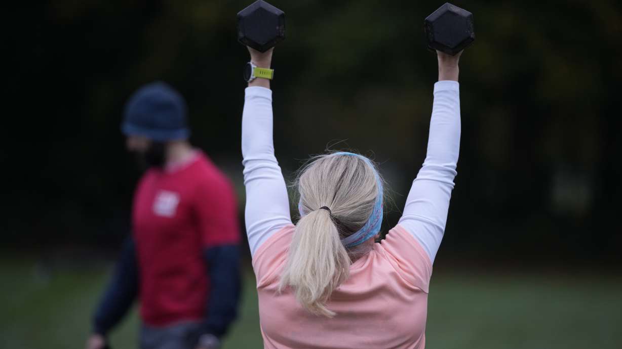 Personal fitness trainer Richard Lamb, leads a group in an outdoor gym class in London, Saturday, Oct. 26, 2024.