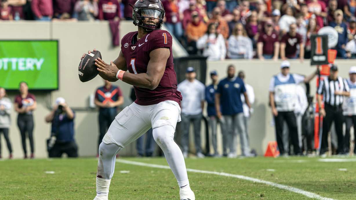 Virginia Tech's Kyron Drones (1) sets up to throw downfield against Georgia Tech during the second half of an NCAA college football game, Saturday, Oct. 26, 2024, in Blacksburg, Va.