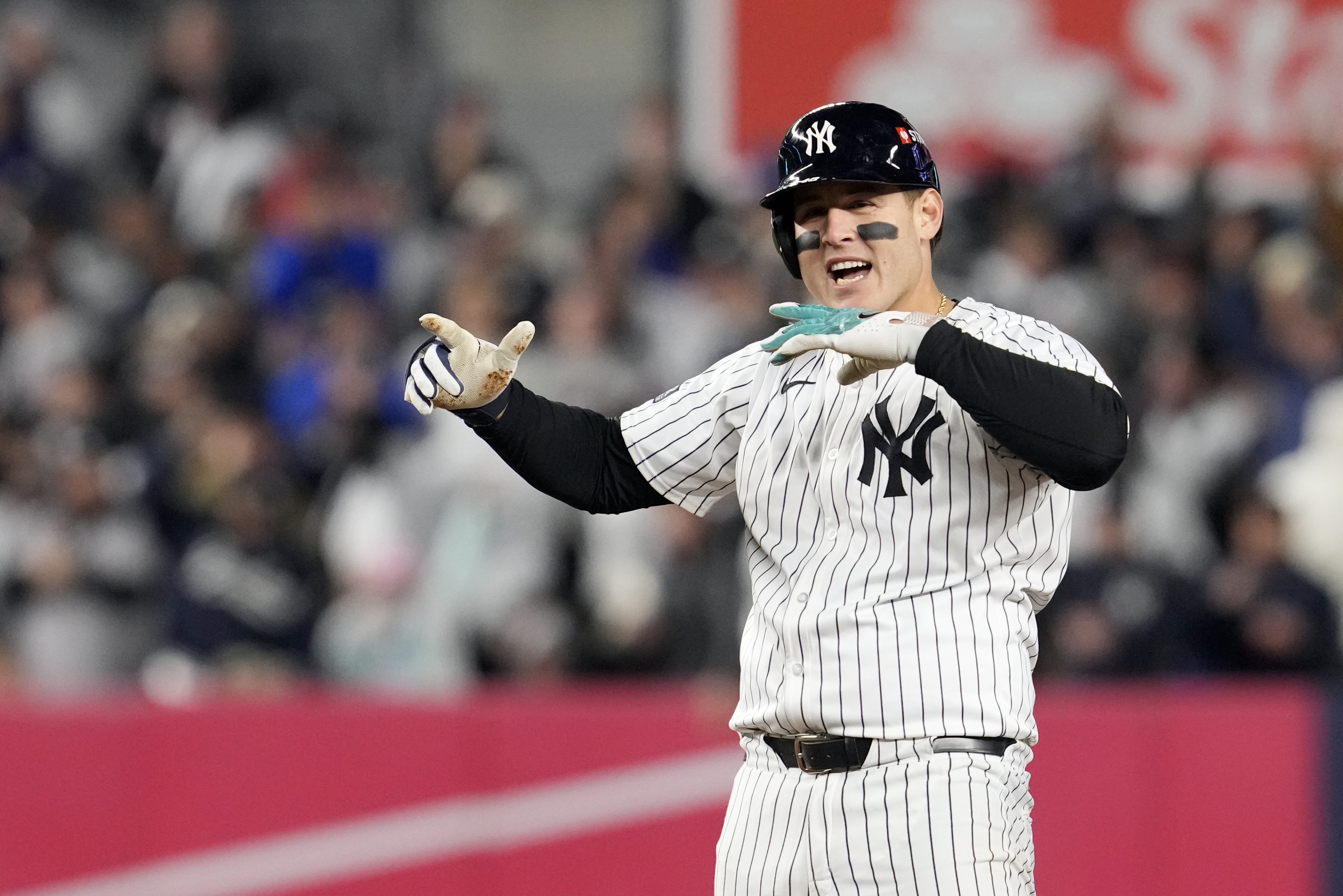 New York Yankees' Anthony Rizzo celebrates after hitting a RBI double against the Cleveland Guardians during the sixth inning in Game 2 of the baseball AL Championship Series Tuesday, Oct. 15, 2024, in New York.