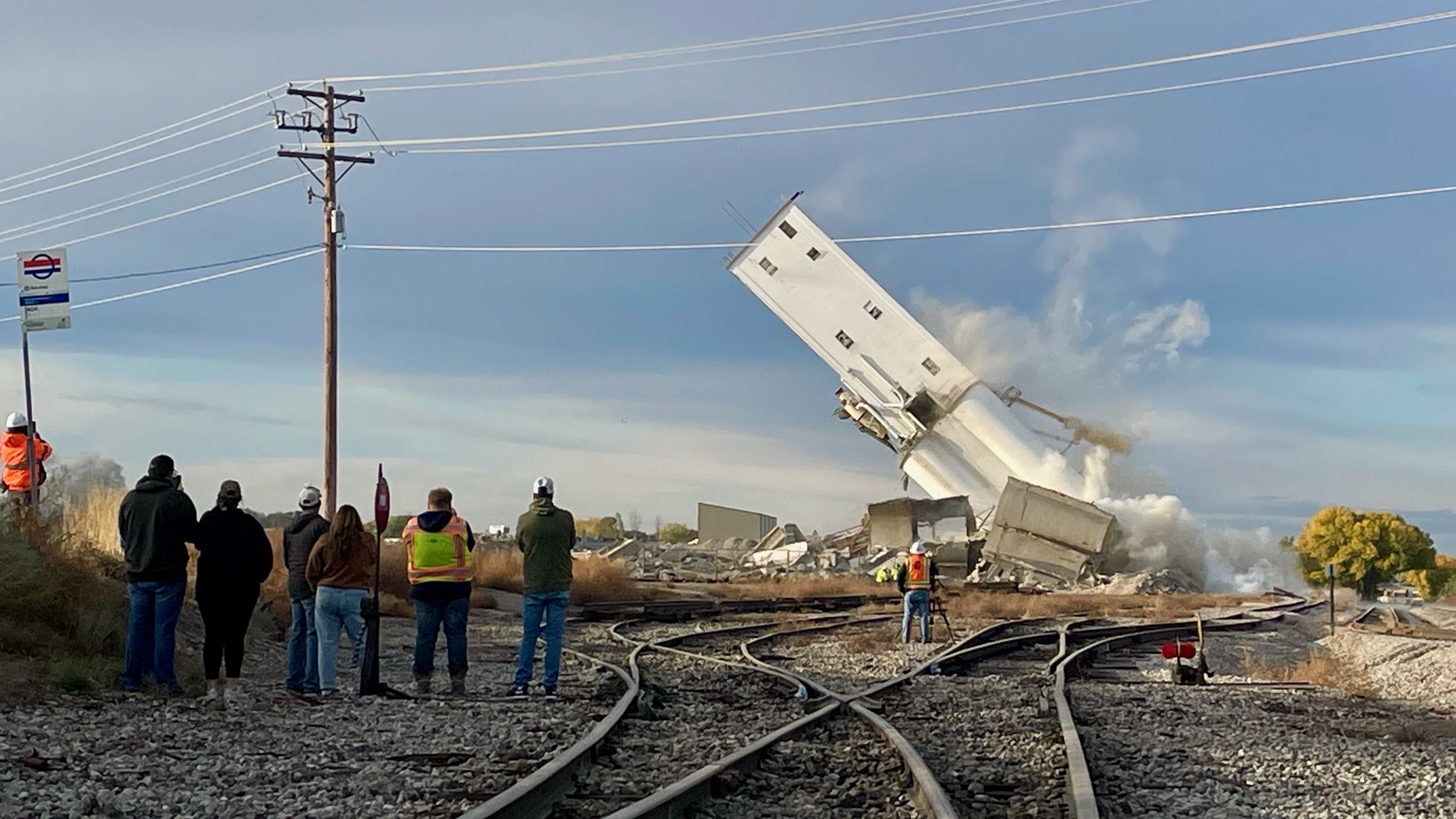 The second of two head houses at the old Farmers Grain Cooperative grain elevator in Ogden fell after it was detonated with explosives on Saturday.