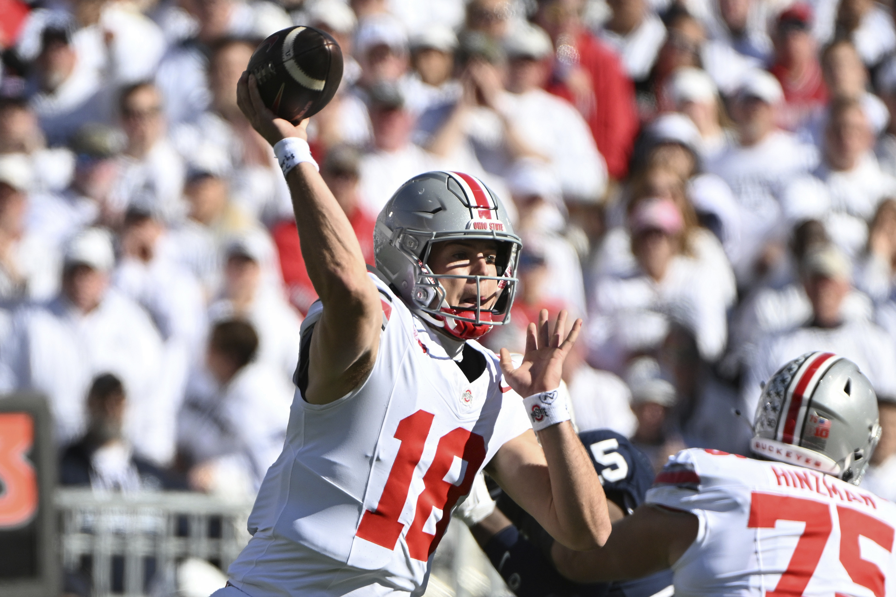 Ohio State quarterback Will Howard (18) throws a pass during the first quarter of an NCAA college football game against Penn State, Saturday, Nov. 2, 2024, in State College, Pa.