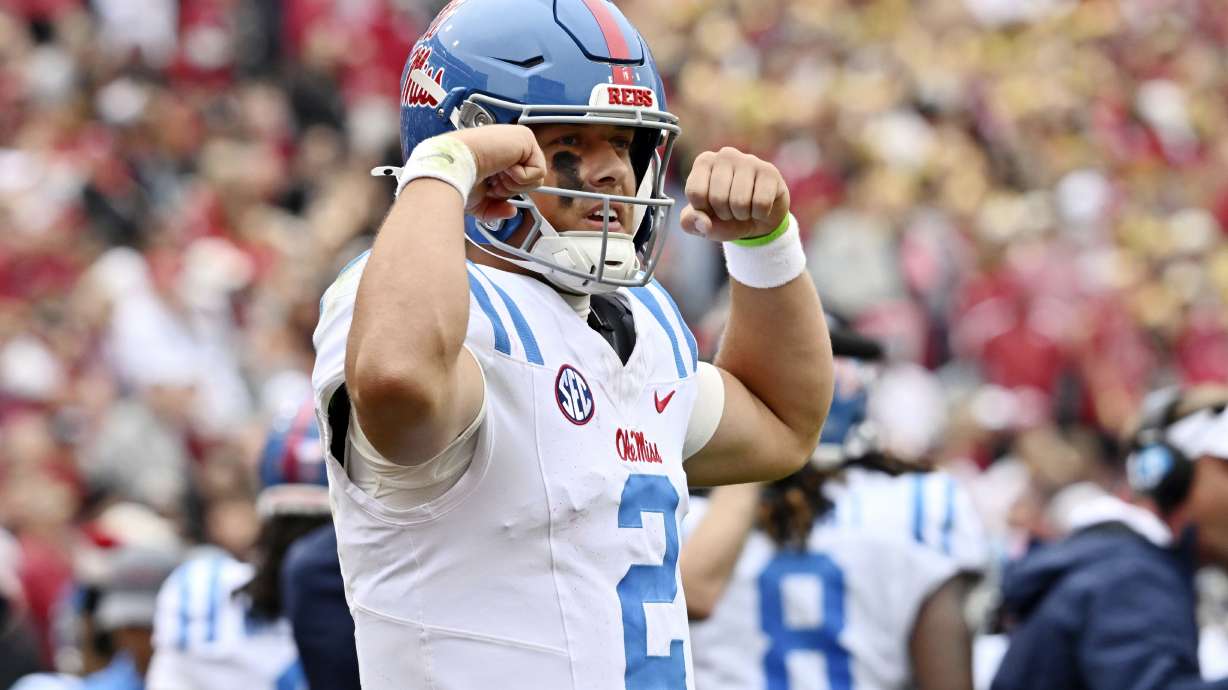 Mississippi quarterback Jaxson Dart (2) celebrates after throwing a 62-yard touchdown pass against Arkansas during the first half of an NCAA college football game Saturday, Nov. 2, 2024, in Fayetteville, Ark.