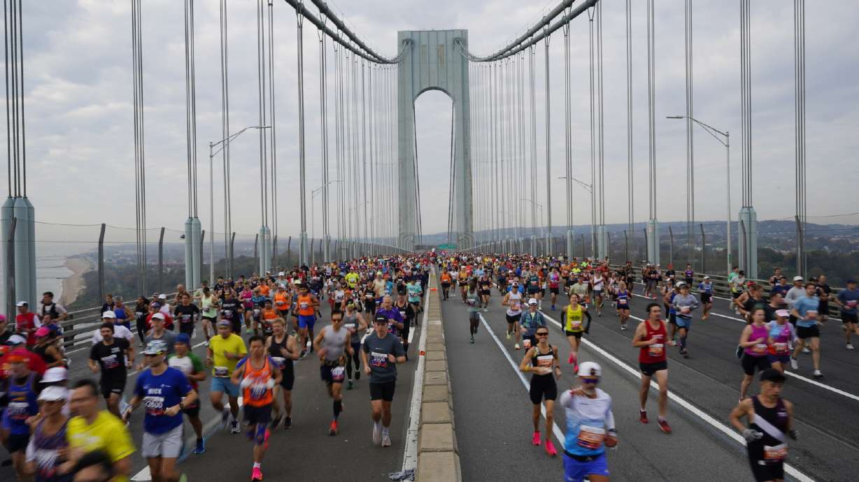 Runners cross the Verrazzano-Narrows Bridge at the start of the New York City Marathon, in New York, Sunday, Nov. 5, 2023.