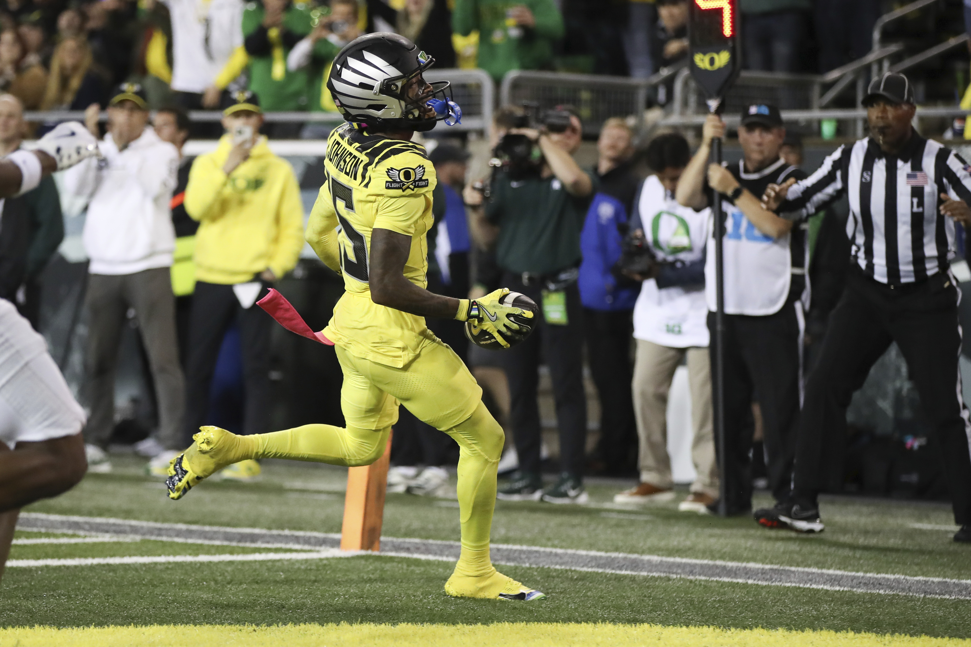 Oregon wide receiver Tez Johnson (15) scores a touchdown against Michigan State during the second half of an NCAA college football game, Friday, Oct. 4, 2024, in Eugene, Ore.