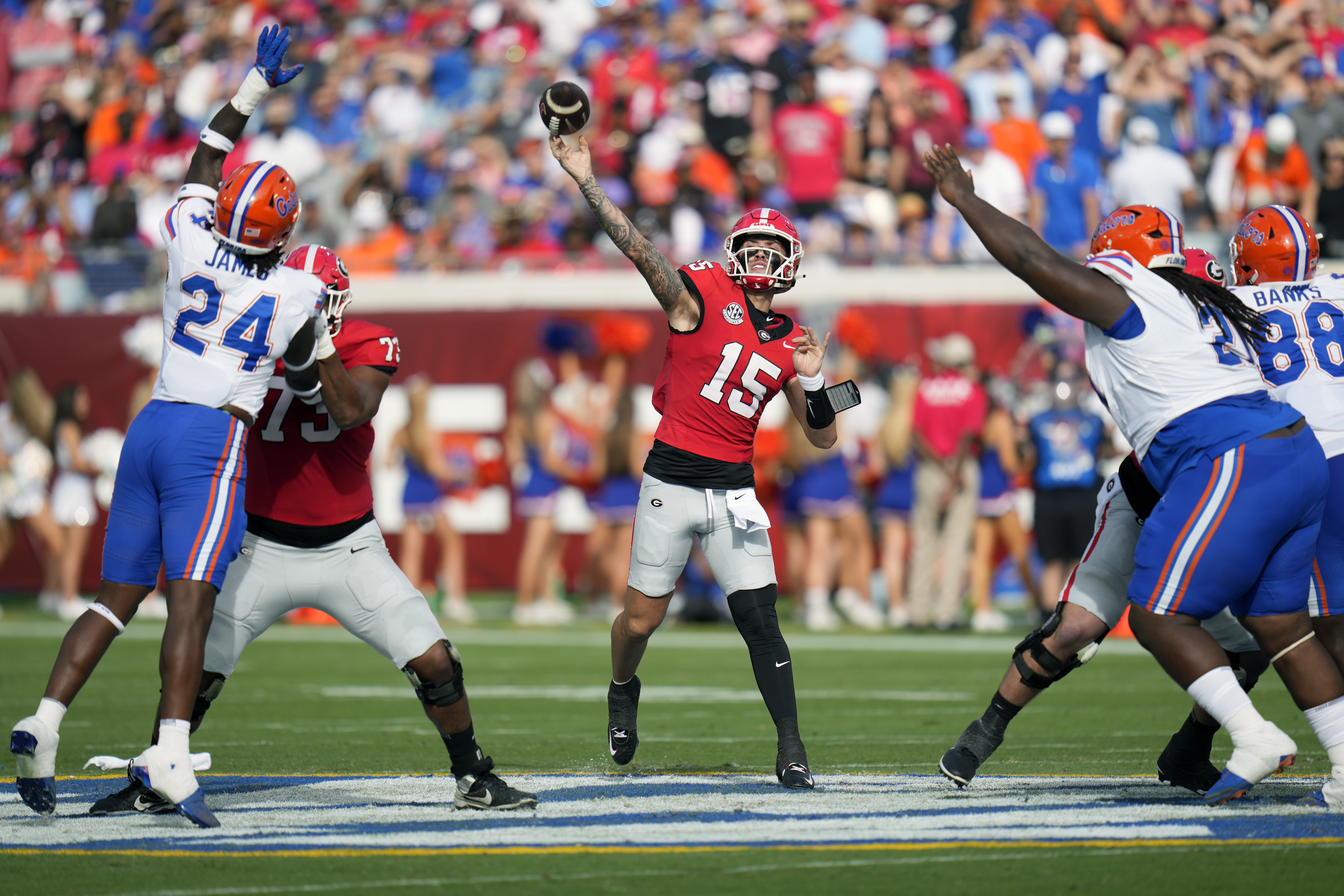 Georgia quarterback Carson Beck (15) throws a pass against Florida during the first half of an NCAA college football game, Saturday, Nov. 2, 2024, in Jacksonville, Fla.