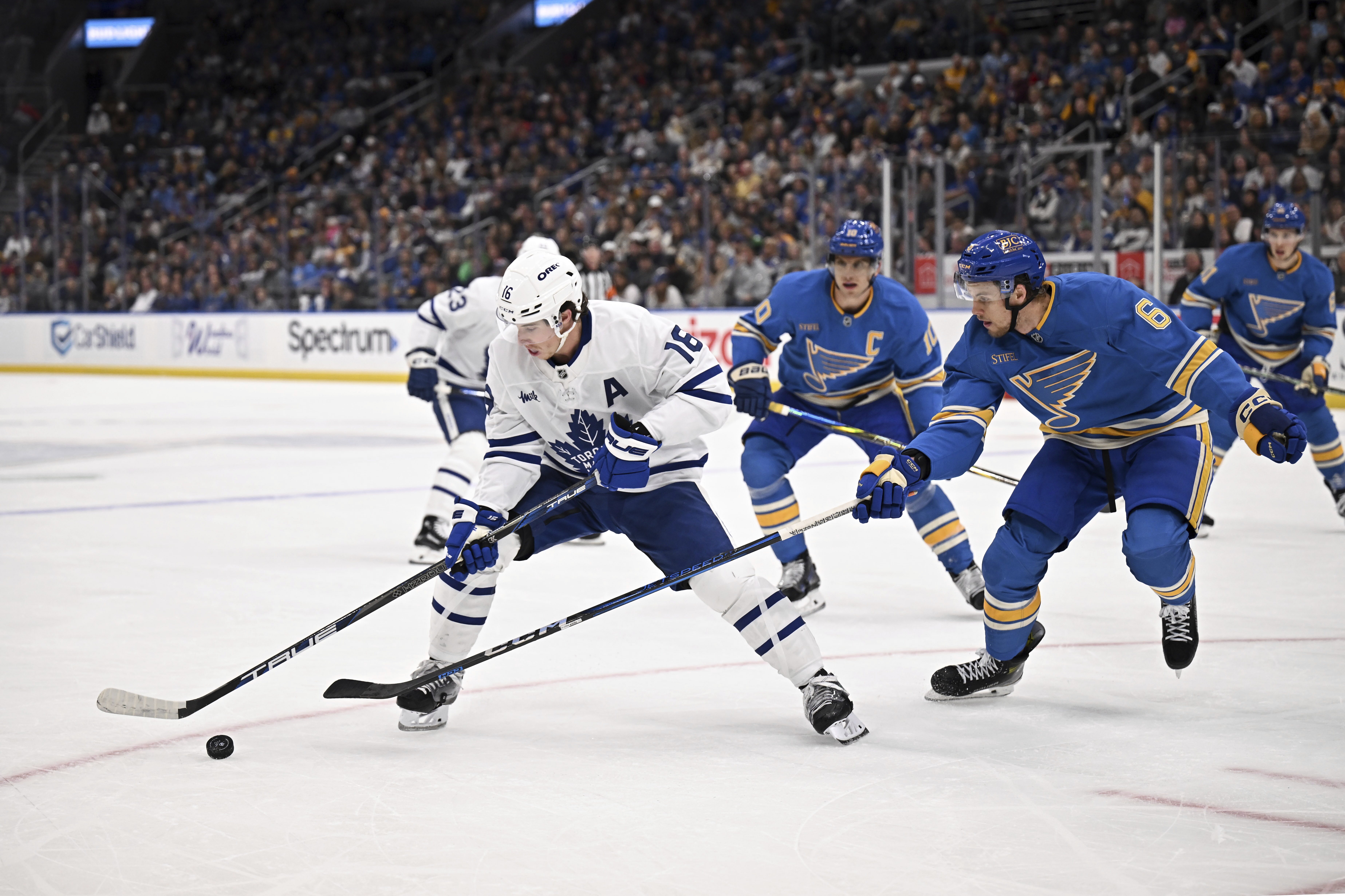 Toronto Maple Leafs' Mitch Marner (15) controls the puck as St. Louis Blues' Philip Broberg (6) defends during the first period of an NHL hockey game Saturday, Nov. 2, 2024, in St. Louis.