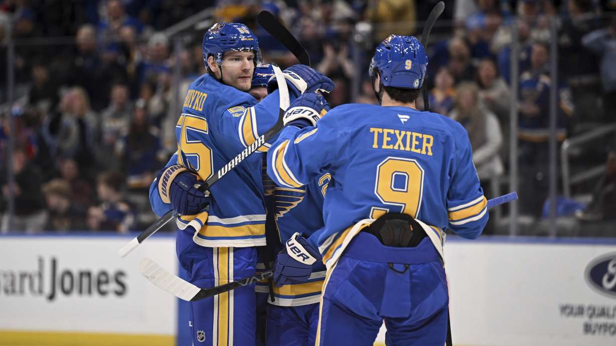 St. Louis Blues' Colton Parayko, left, celebrates with teammates after scoring during the second period of an NHL hockey game against the Toronto Maple Leafs, Saturday, Nov. 2, 2024, in St. Louis.